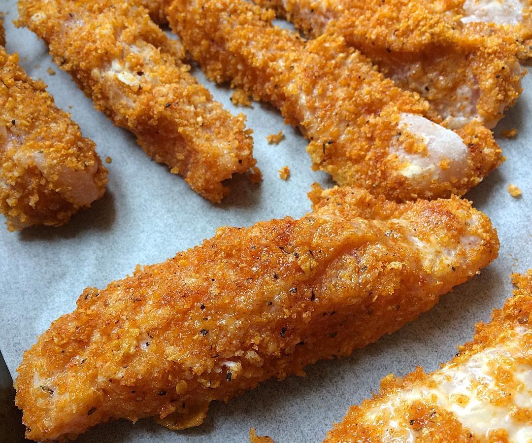 Corn flakes coated spicey chicken sticks to the oven for 15 minutes at...