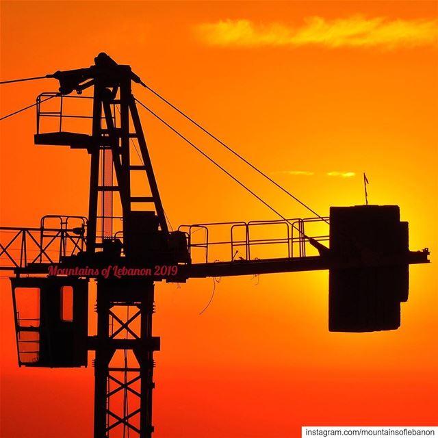 Crane hammering the sun! 🙄 cranes  construction  orangesunset ... (Beirut, Lebanon)