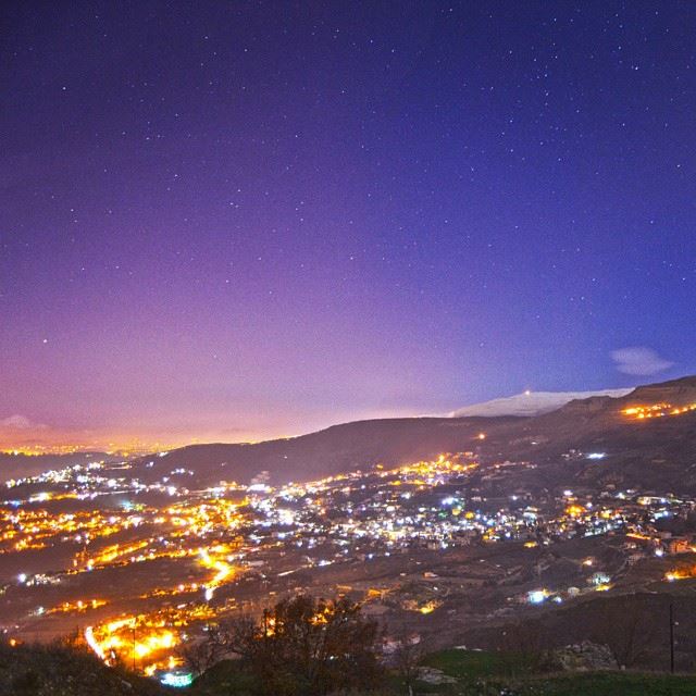 Falougha village through starry night.. and sannine mountain covered with...
