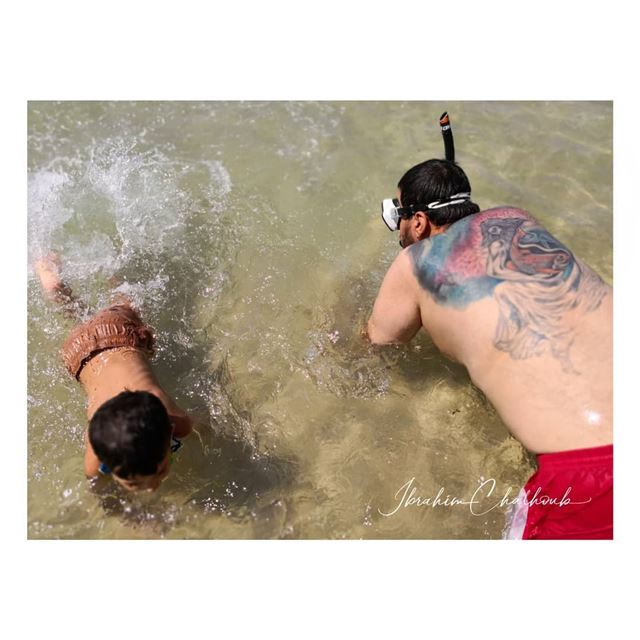 Father and son...a story at the beach -  ichalhoub in  Batroun north ...