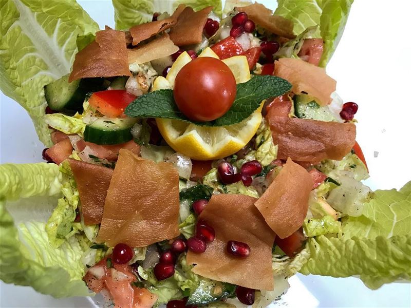 Fattouch Salad:Leafy lettuce, fresh chopped tomatoes, cucumbers and...