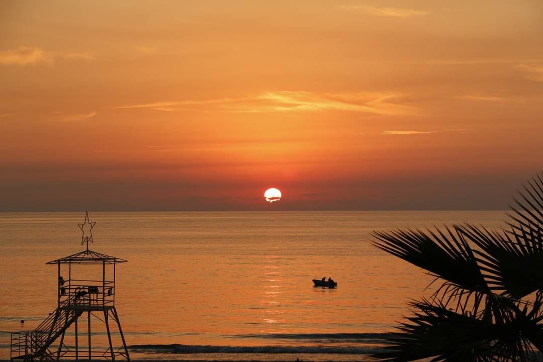  fishing on a burning sea... sunset  ig_sunset  sunsetlovers  ilovesunset... (Ramlat Al Bayda', Beyrouth, Lebanon)