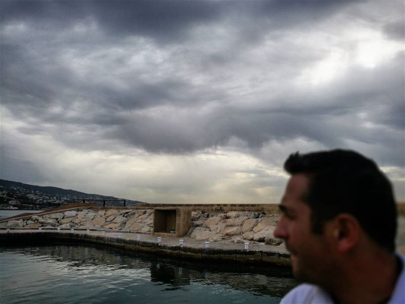 Flat sea, clouds and a diver -  ichalhoub in  Batroun north  Lebanon...