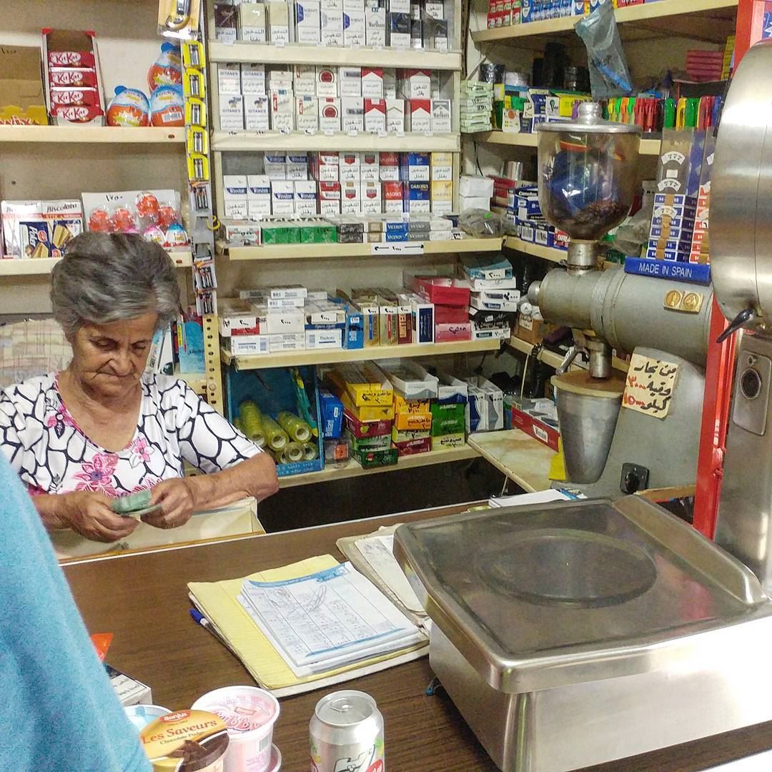 Four feet sweet as can be mini market owner counting change. Notice coffee... (Dayr Al Qamar, Mont-Liban, Lebanon)