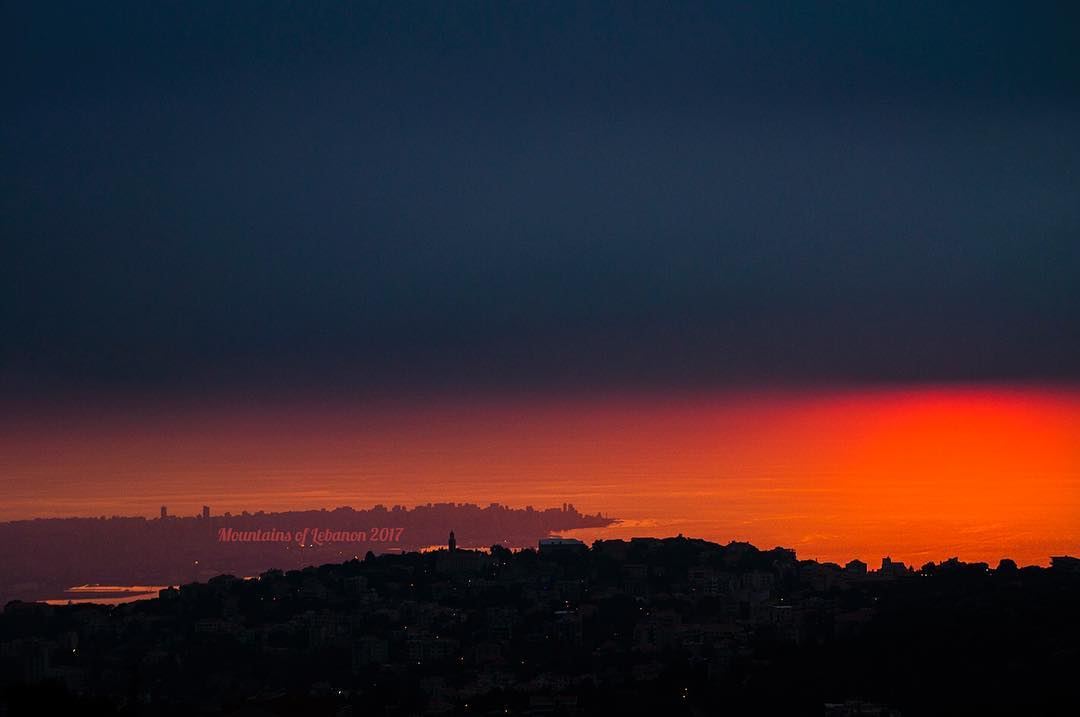 four layered sunset dark foreground of Ajaltoun, Orange background, Beirut... (Klay3at)