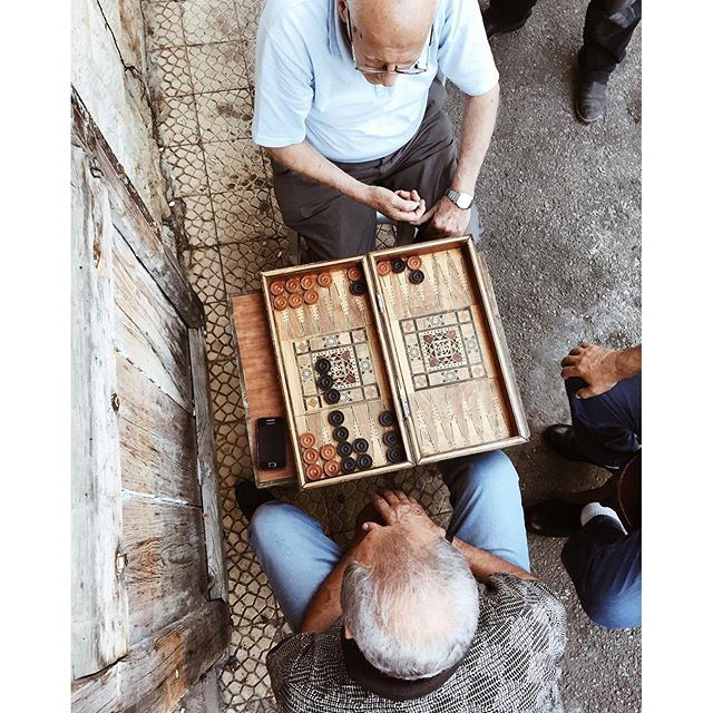 Gathered around the "tawleh" to watch the game and listen to the old men's stories DoumaByALocal liveauthentic (Douma Souks)