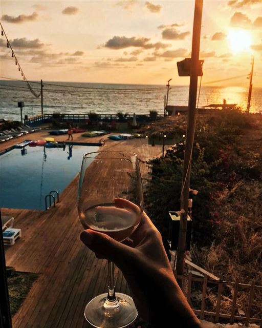Happiness in a glass 🍷 batroun  sunset  wine  drink  lebanon  beirut ... (Kfarabida Garden)