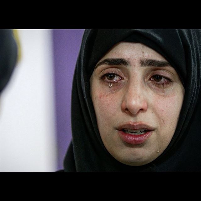 Hawraa Taleb weeps near her maternal cousin Haidar Mustafa, a three-year-ol