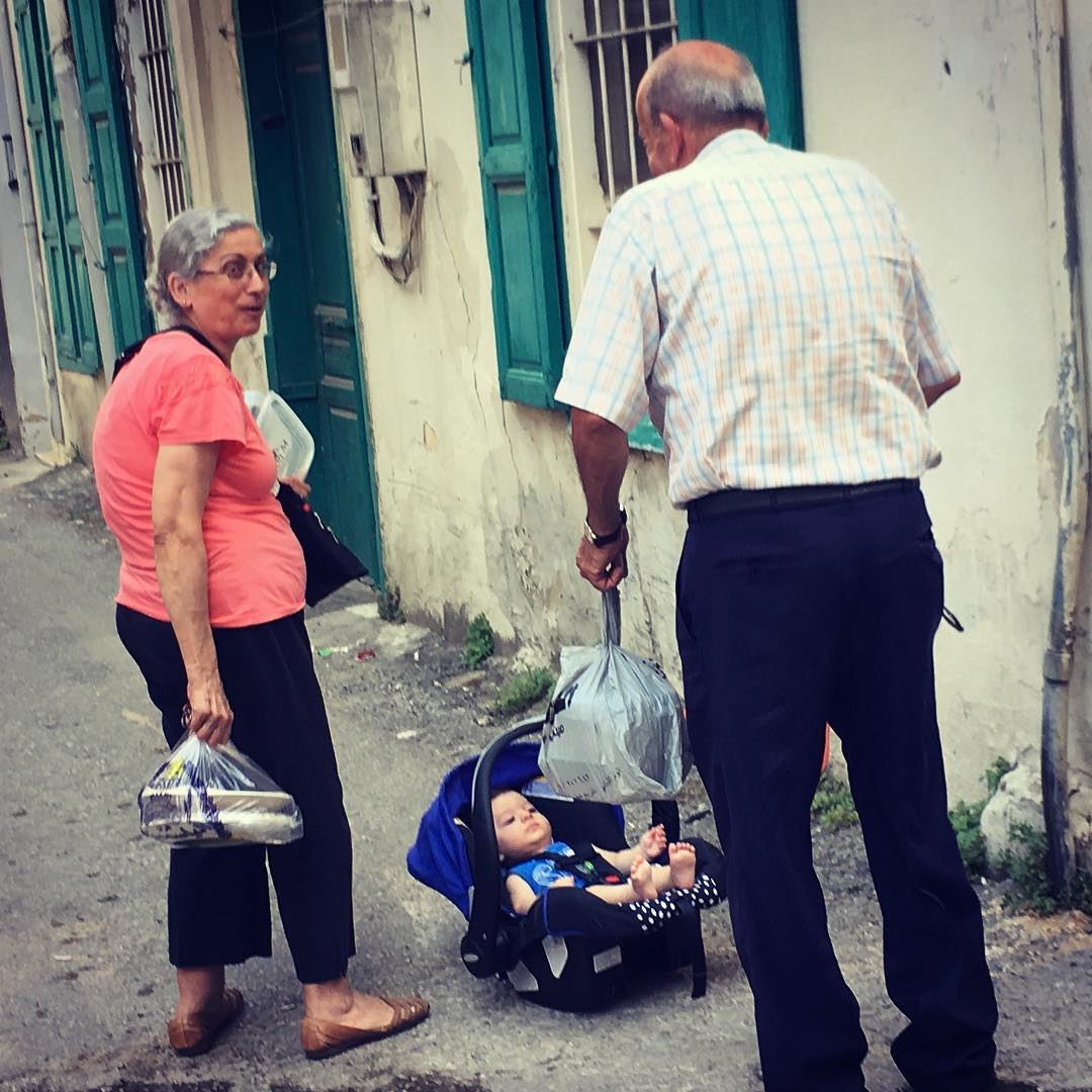 “He’s not mine” the man says ...  baby  streetphotography  lost  elder ... (Mar Mikhael-Armenia The Street)