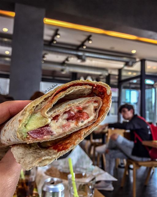 i think he is having a fight with my hummus and avocado wrap... foodie ... (Zaatar W Zeit)