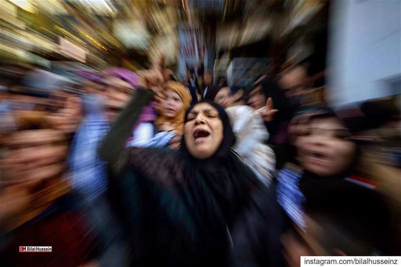 In this photo made with a slow shutter speed, Palestinian chant slogans...