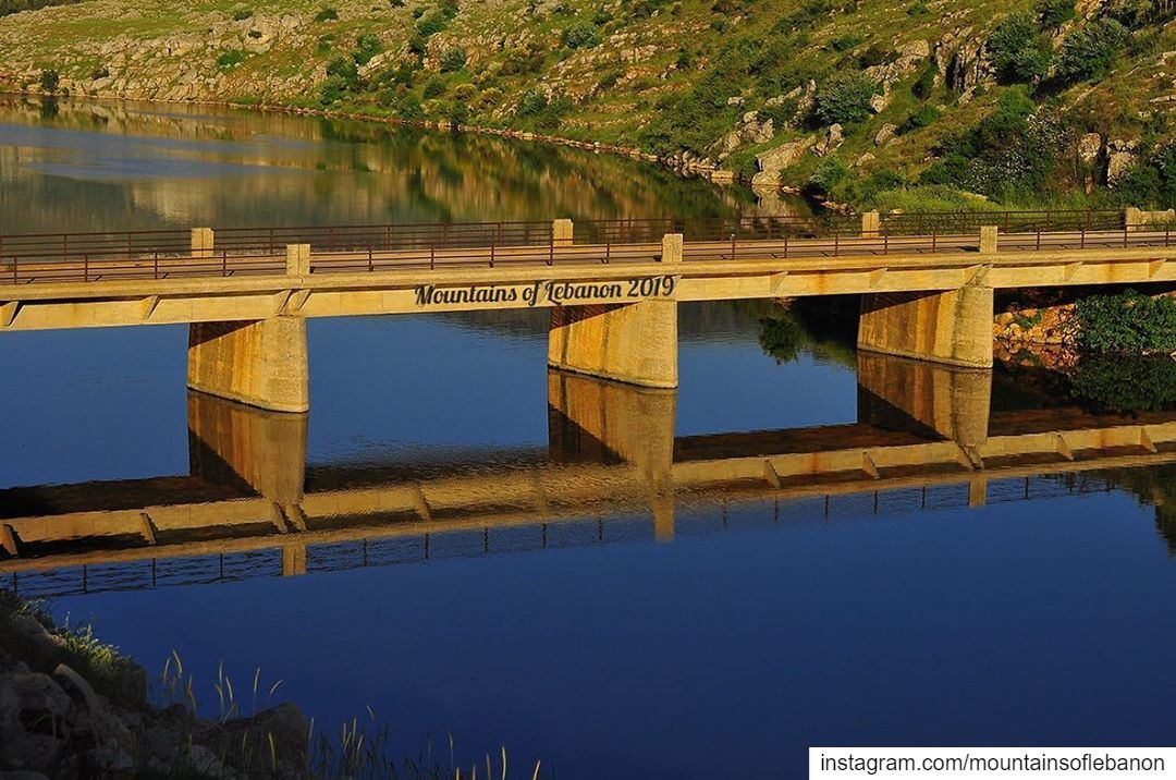 Just a bridge and its reflection during golden hour...... roadtrip ... (Lac de Qaraaoun)