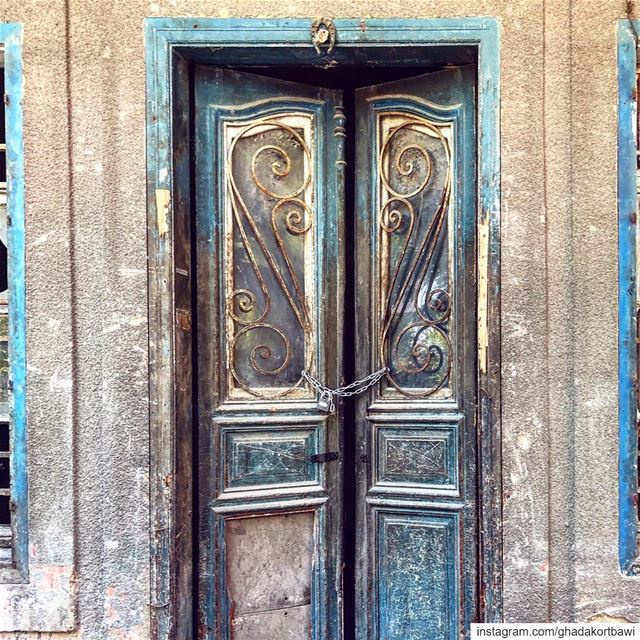Knocked out horseshoeforluck ..... bluedoor  old  vintage  worndown ... (Beirut, Lebanon)