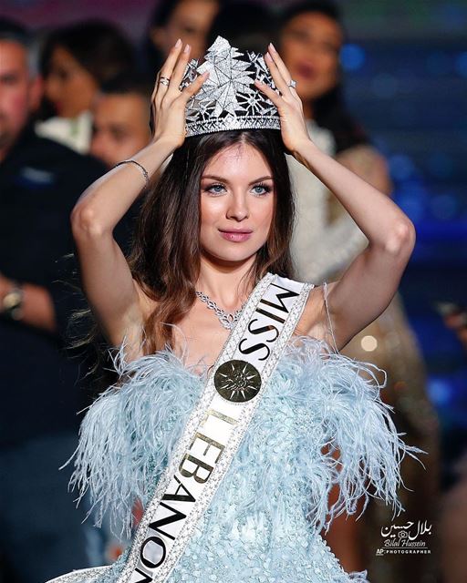 Lebanese Maya Reaidy, newly crowned Miss Lebanon, fixes her crown after...