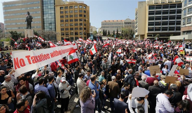 Lebanese protest against new high taxes in front of the government palace in Beirut. (NABIL MOUNZER / EPA)  via pow.photos