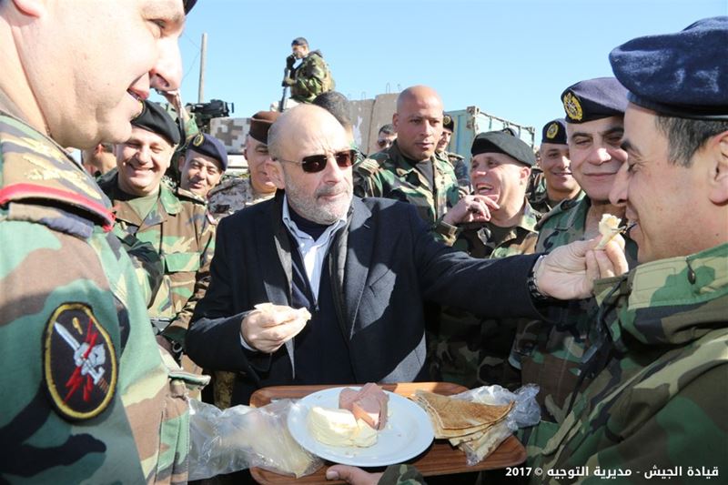 Minister of defence Yaacoub Sarraf feeding a soldier during his today visit to the town of Arsal. (Lebanese army)