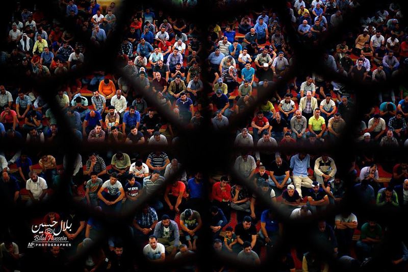 Muslims listen to a sermon on the first Friday of the holy fasting month...