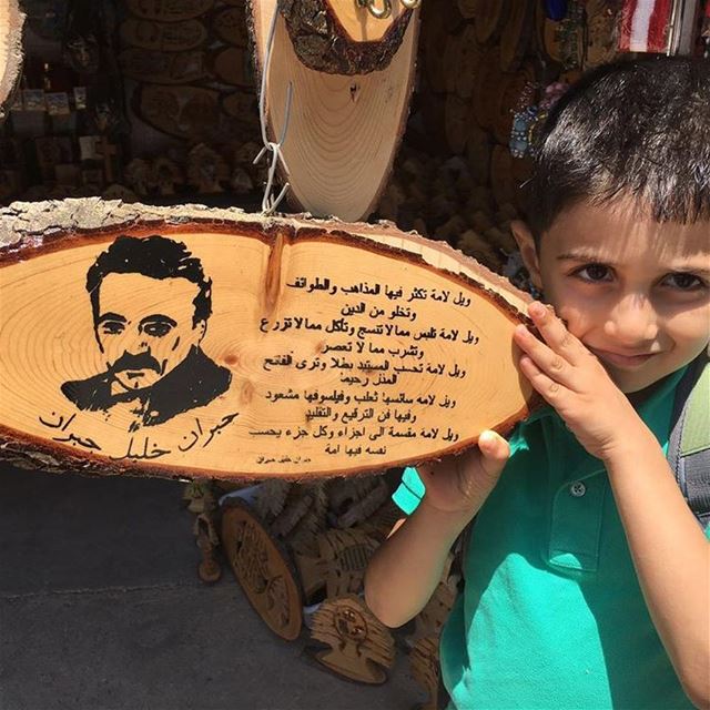 My grandson Jubran is holding the words of the great symbol Jubran Khalil...