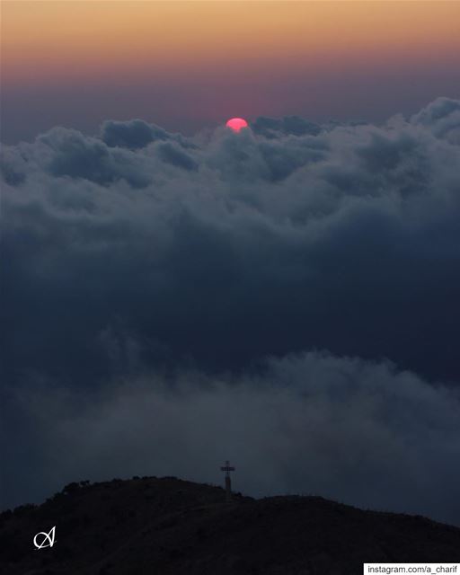 My view of sunset today sunset  sun  sky  cloud  mist  hill  cross  view... (Jezzîne, Al Janub, Lebanon)