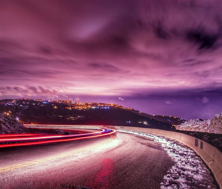 🌌🌌..... night nightphoto longexposure clouds mountains lights road... (Zaarour)