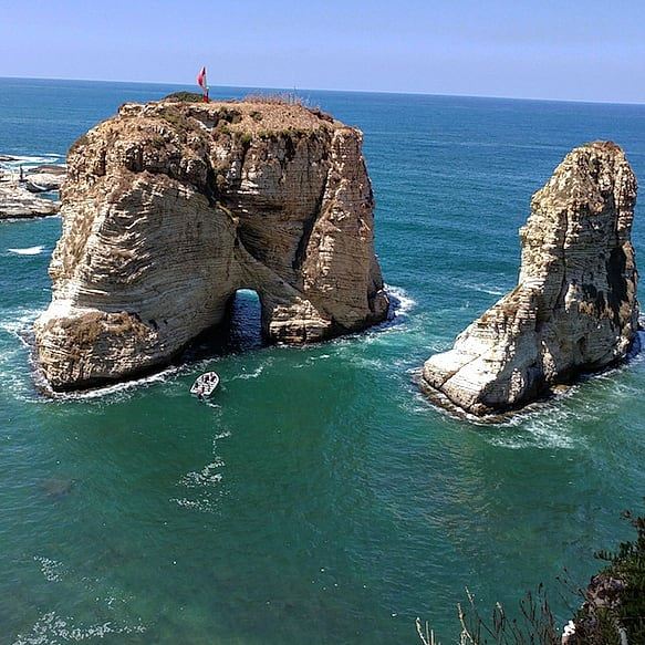 On my bucket list: ride a boat through there😍 landmark  beirutscenes ... (Pigeon Rock Beirut.)