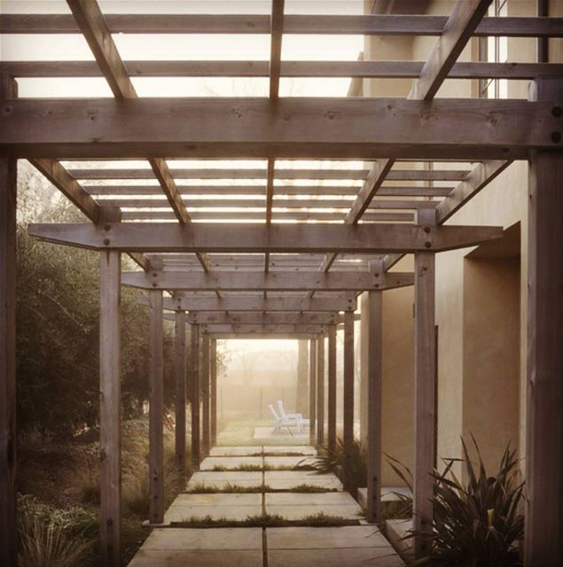 Pergola that runs along the side of the house and connect the front and...