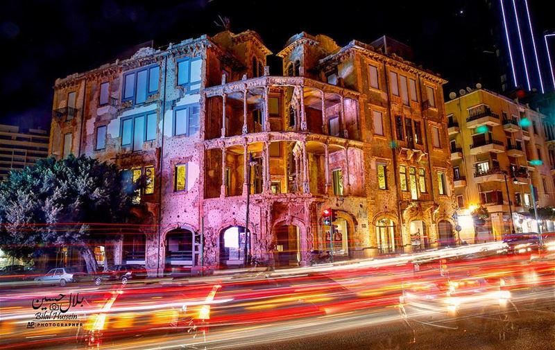 Photo made with a long exposure, shows cars passing in front of Beit...