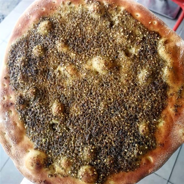 Plain or with veggies, zaatar  man2oushe remains number 1 breakfast for... (Rashet somsom - رشة سمسم)