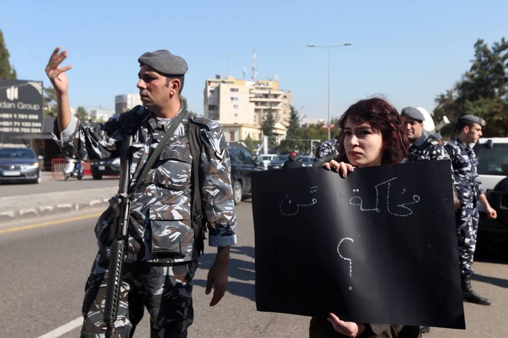Protesters hold banners outside Beirut’s Military Tribunal, where 14 “You Stink” protesters were being prosecuted on charges connected to the protests against the trash crisis. (Hasan Shaaban)
