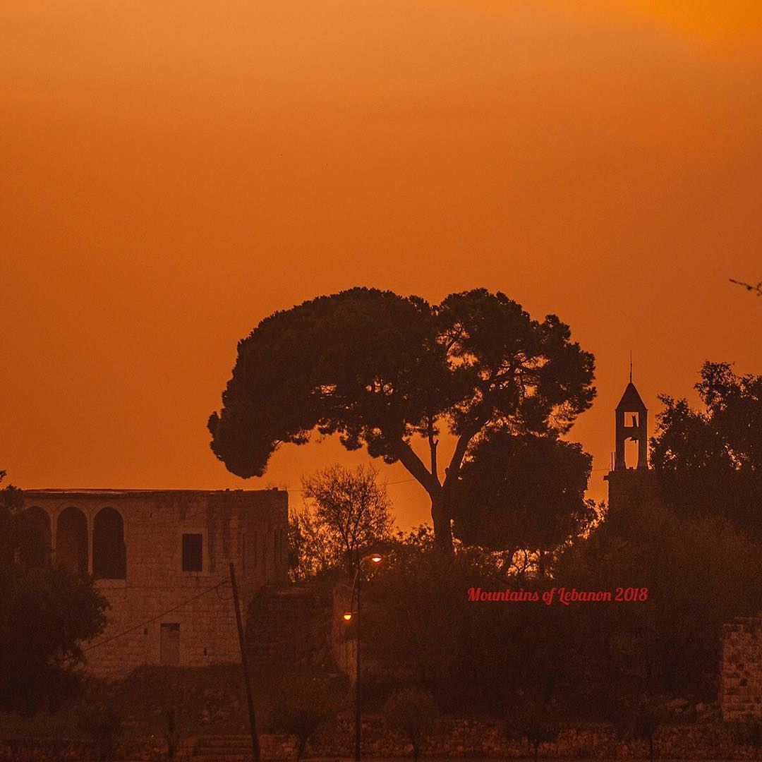 Rain or cloud before sunset turns the sky orange! over the bell tower of... (Ballouneh, Mont-Liban, Lebanon)