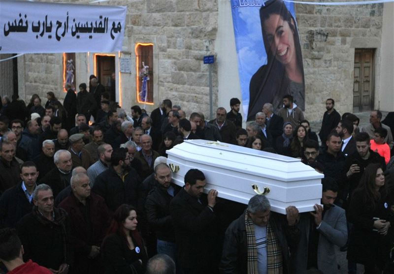 Relatives and friends of Rita al-Shami, who was killed in the New Year’s Eve Istanbul attack, carry her coffin during her funeral procession, in Joun. 