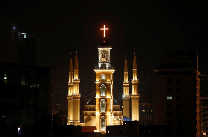 Saint George Maronite Cathedral’s cross is lit during the inauguration of its bell tower in downtown Beirut.