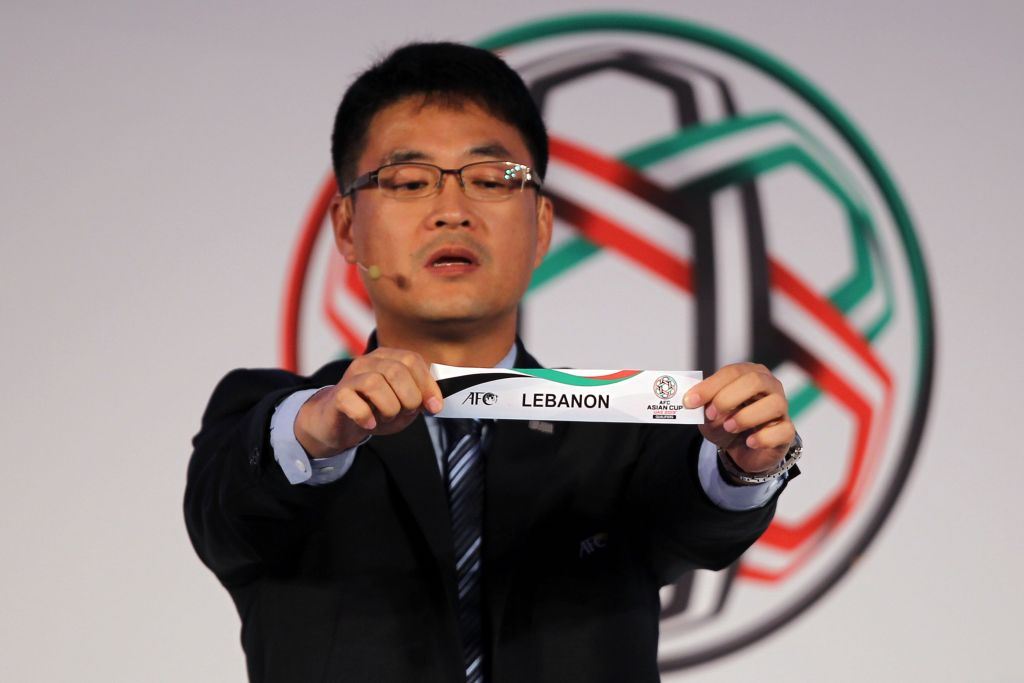 Shin Man Gil, Executive Director AFC Competitions Division, draws Lebanon during the AFC Asian Cup UAE 2019 Qualifiers Final Round draw in Abu Dhabi. (NEZAR BALOUT / AFP)