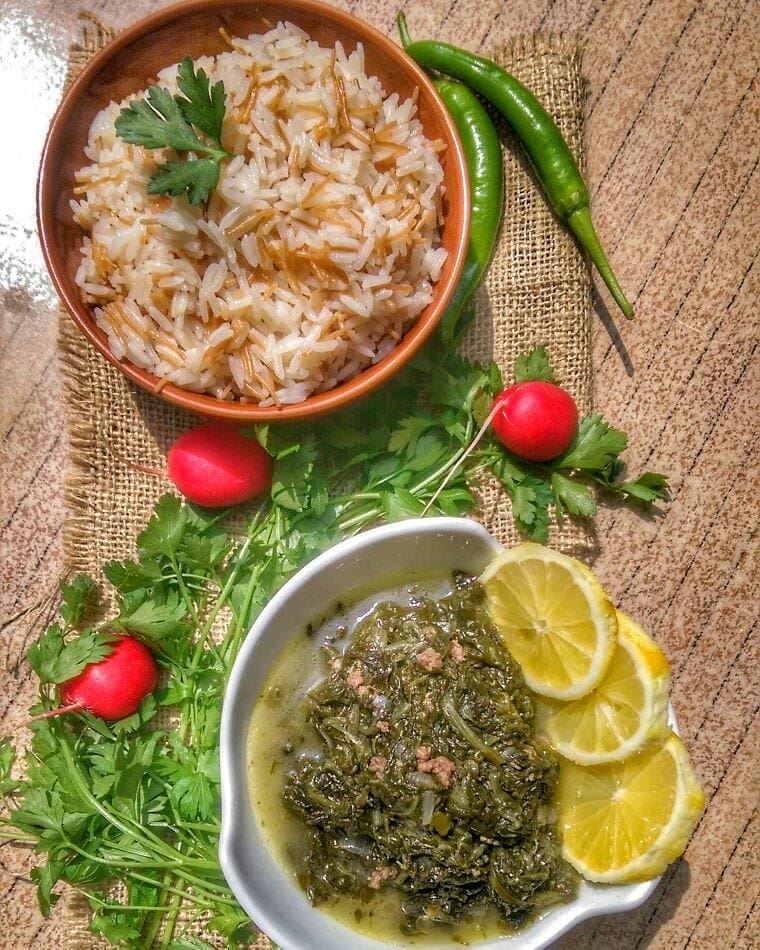 Spinach with Rice and Shawarma Chicken for lunch today at Em's. Give us a... (Em's cuisine)