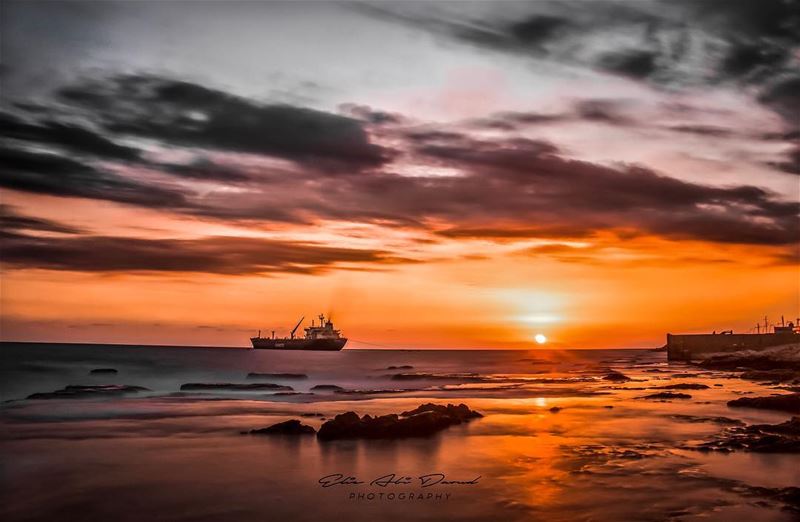 Summer’s final days 🌞  sea  sunset  clouds  boat  rock  sky  magical ... (`Amshit, Mont-Liban, Lebanon)