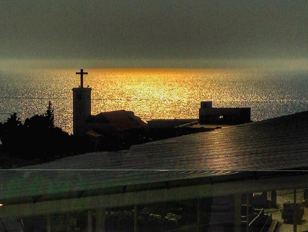 Sunset...❤️  lebanon  keserwen  okaibe  sea  sunset  church  cross  igers ... (Encore Seaview)