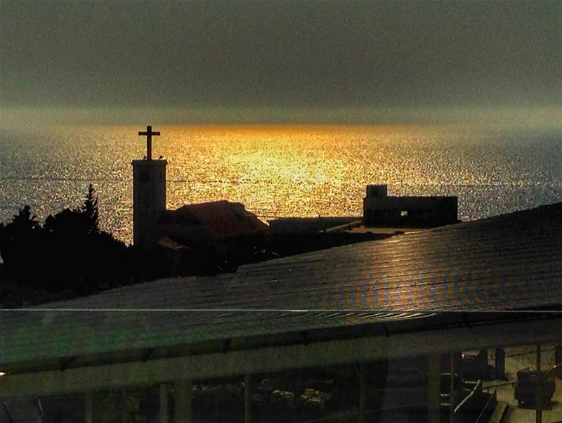 Sunset...❤️  lebanon  keserwen  okaibe  sea  sunset  church  cross  igers ... (Encore Seaview)