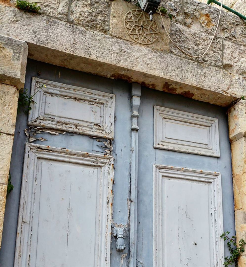 Sure the door could use a fresh coat of paint but I love the weed... (Dayr Al Qamar, Mont-Liban, Lebanon)