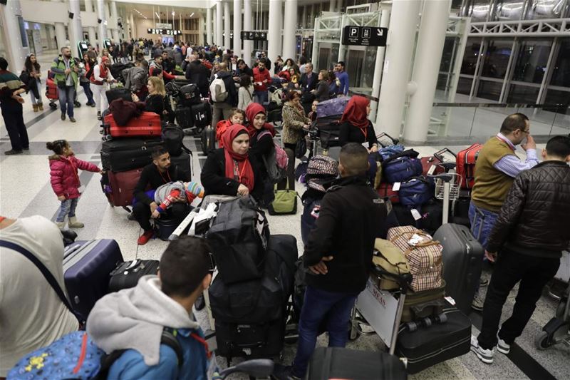 Syrian refugees, who were granted humanitarian visas by Italy gather in Beirut’s International airport. (JOSEPH EID / AFP) via pow.photos