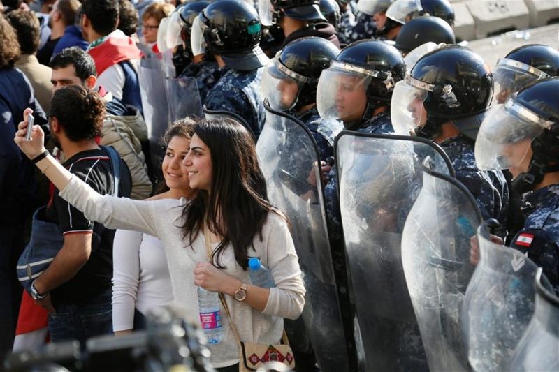 Taking a selfie with security forces during a protest in Beirut. (Ratib Al Safadi / Anadolu Agency) via pow.photos