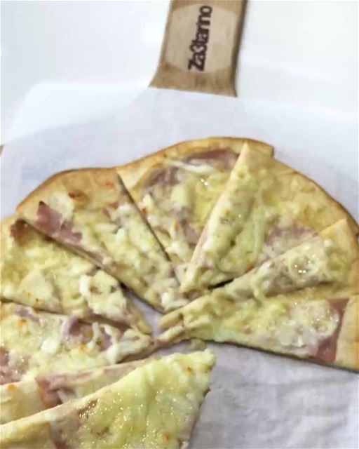 Tasty flatbread  with ham and cheese. They make a delicious and tasty...
