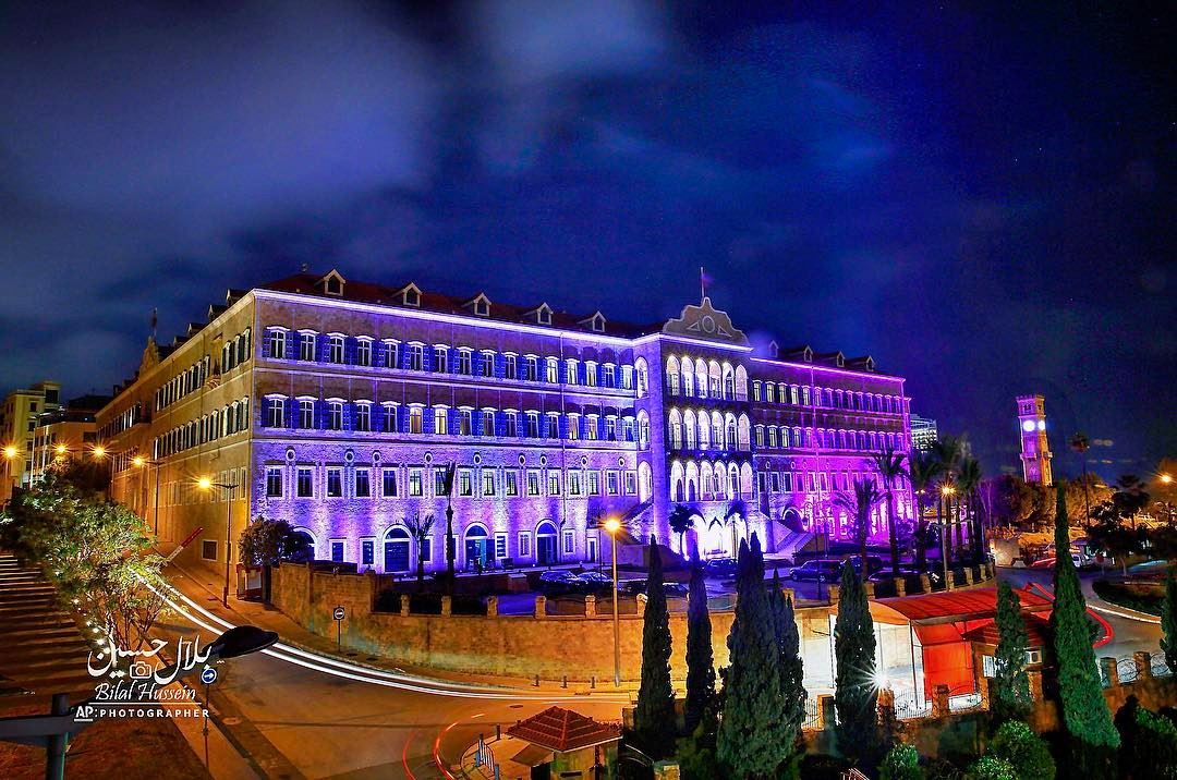 The government headquarters is illuminated in purple and fuchsia to mark...