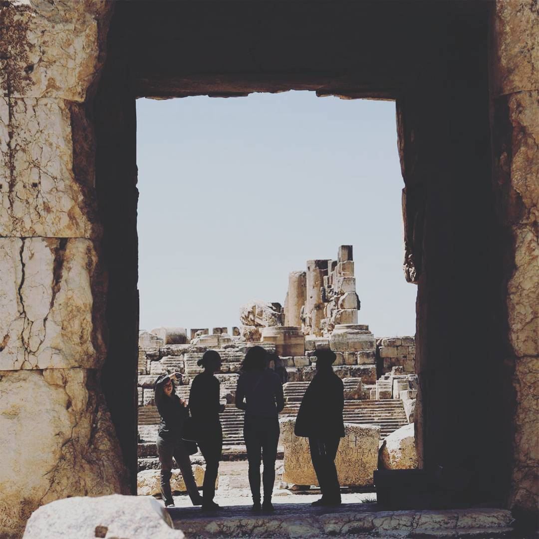 "The guide" a group of tourists being guided through the old ruins of... (Baalbek, Lebanon)