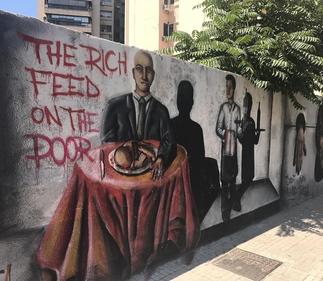 "THE RICH FEED ON THE POOR" - A graffiti that tackles a dangerous... (Verdun)