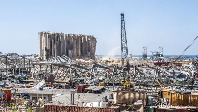 The still standing wheat storage and the explosion area in Beirut Port