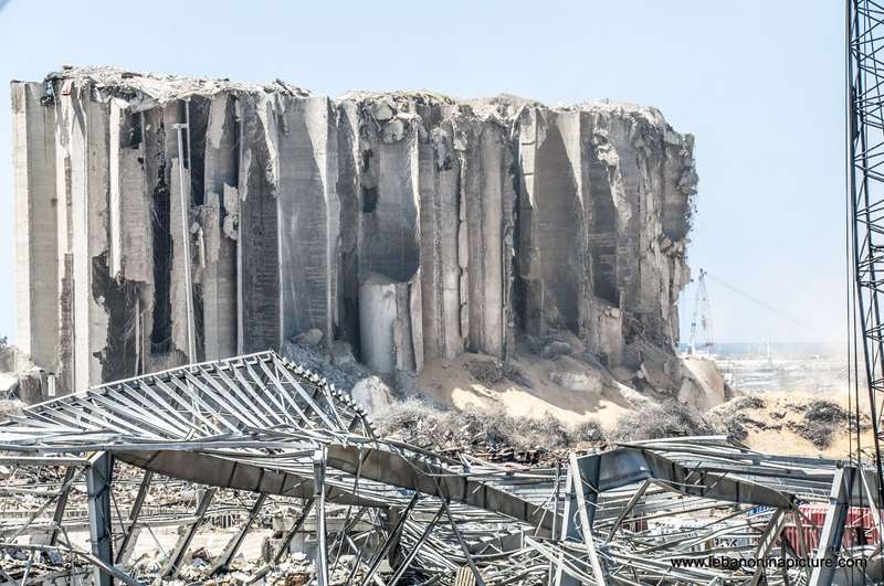 The still standing wheat storage and the explosion area in Beirut Port