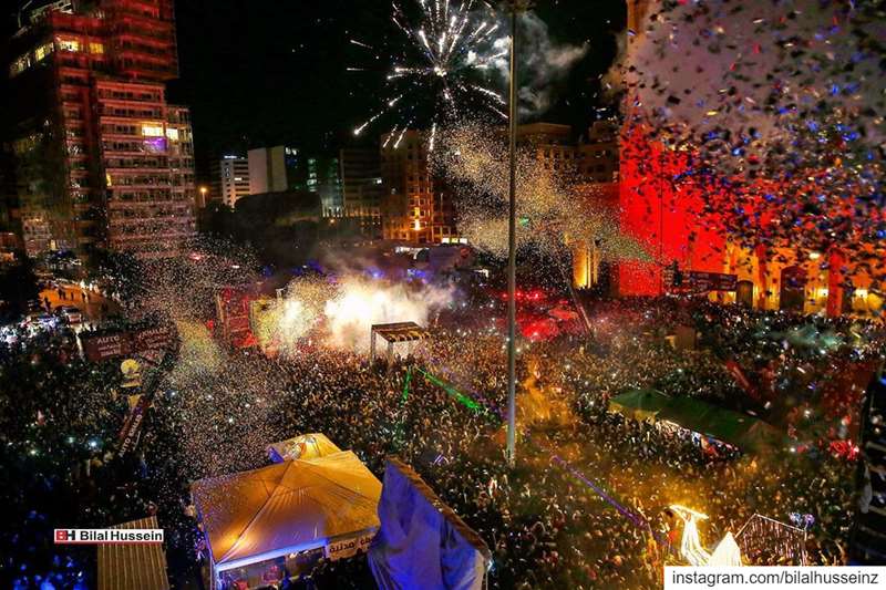 Thousands of anti-government protesters and citizens watch a firework...