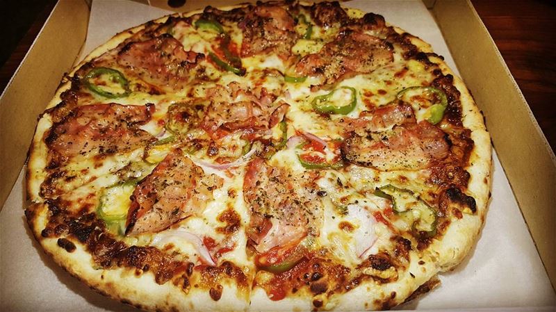 We're featuring today one of the best pizzas in town; the PORKOI PAS made... (Micelli's)