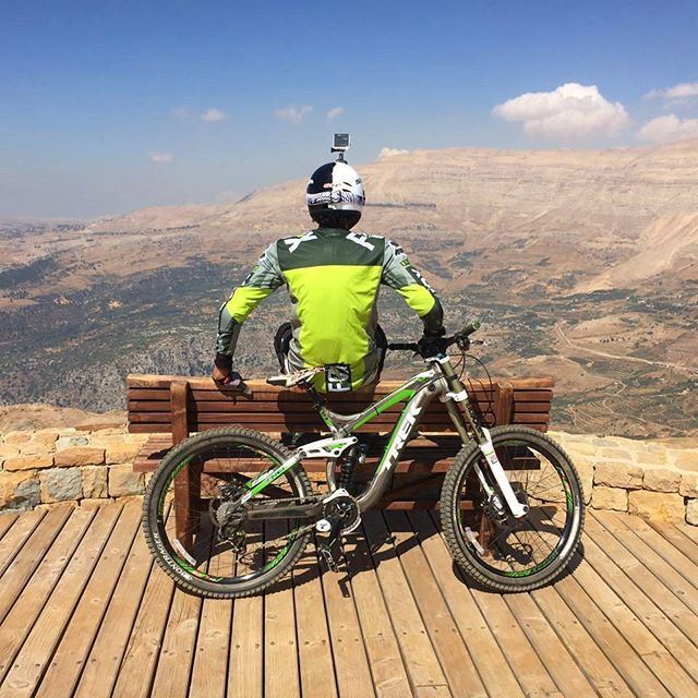 When you have adventures ahead of you, lay your back on your monster  bike and enjoy the view.  downhill