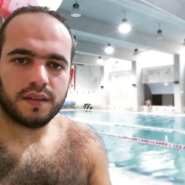 While it was  raining and  snowing in  Lebanon ...I was  swimming  pool ...